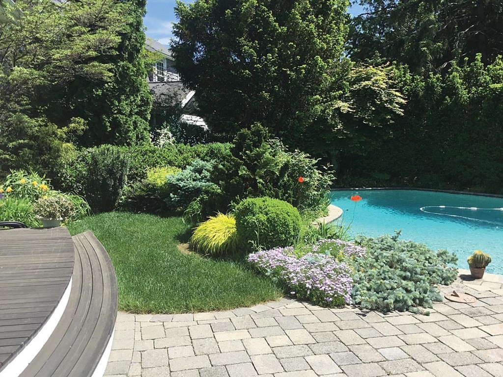 26 Islington Road Newton, MA 02466 - Photo 16 of 18 a view of a garden with a pathway