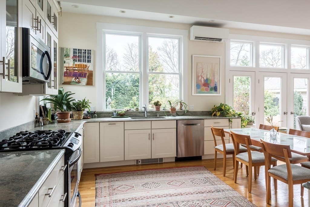 26 Islington Road Newton, MA 02466 - Photo 7 of 18 a kitchen with a sink stove and cabinets