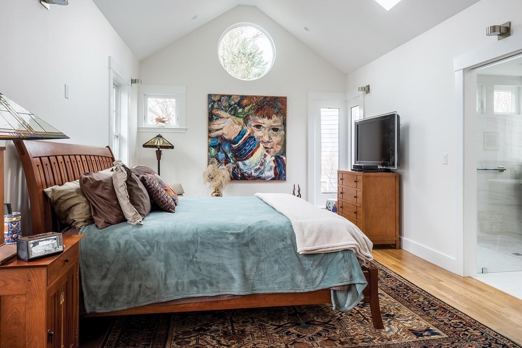 26 Islington Road Newton, MA 02466 - Photo 9 of 18 a bedroom with a bed and wooden floor