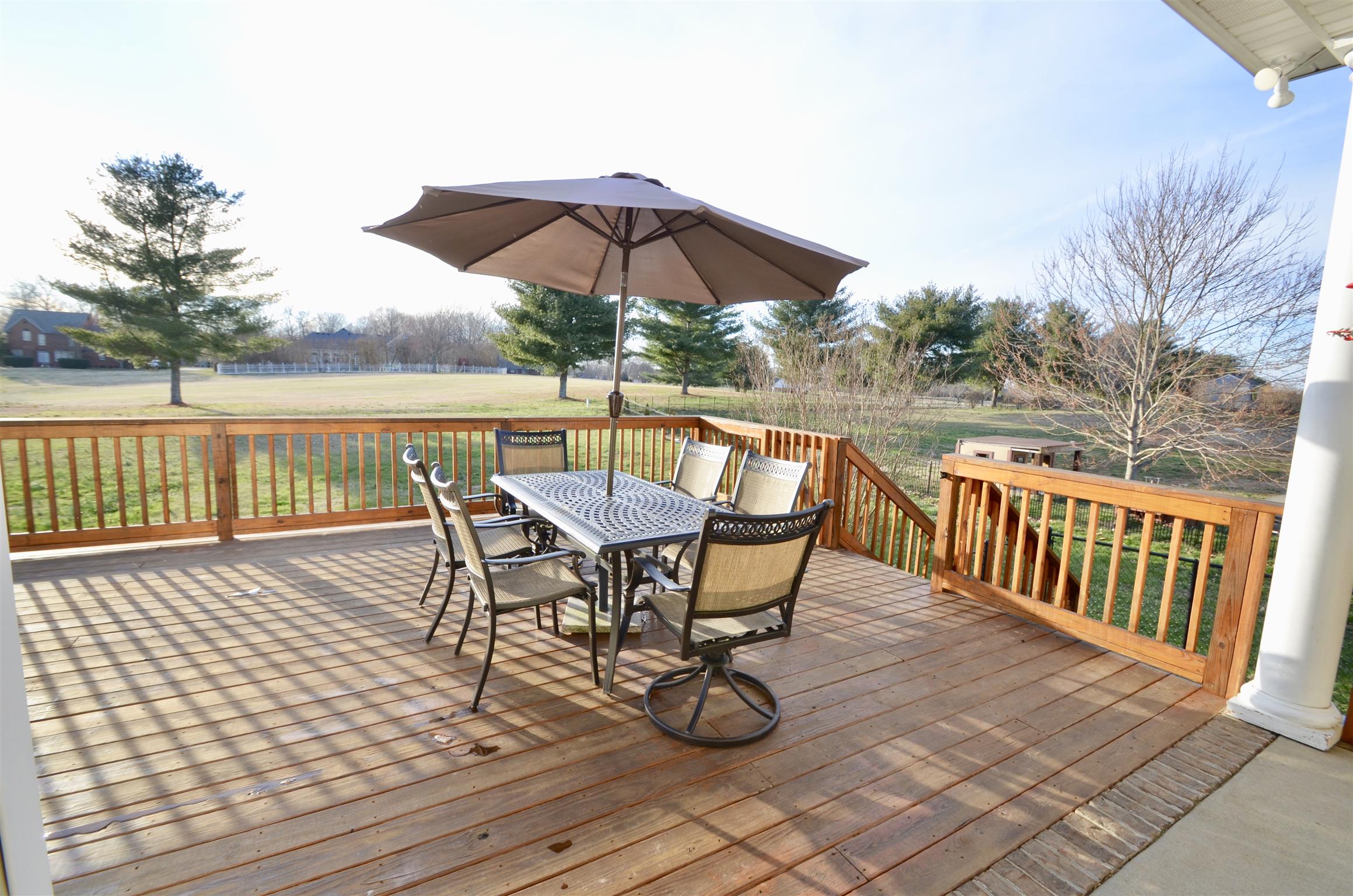 710 Dixie Bee Road Clarksville, TN 37043 - Photo 29 of 30 a view of a roof deck with chair and wooden floor
