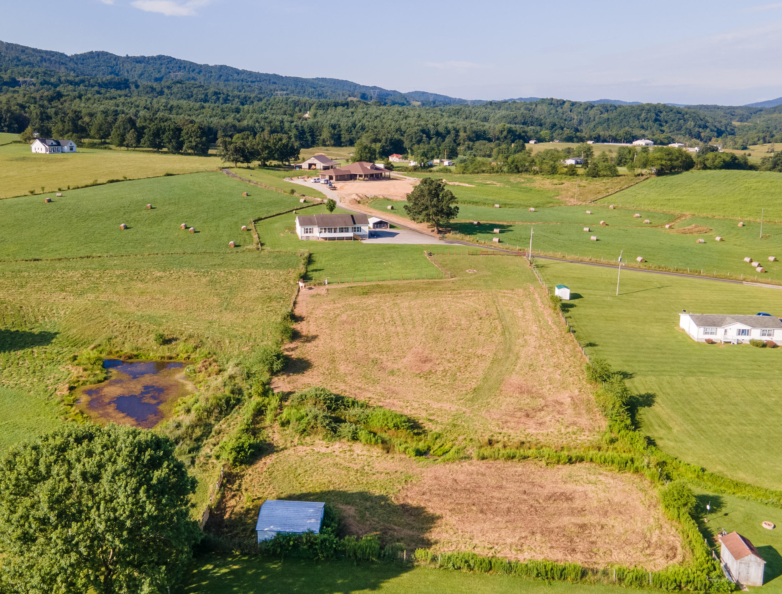 3850 Hopper Lane Riner, VA 24149 - Photo 2 of 50 a view of a lake with a mountain