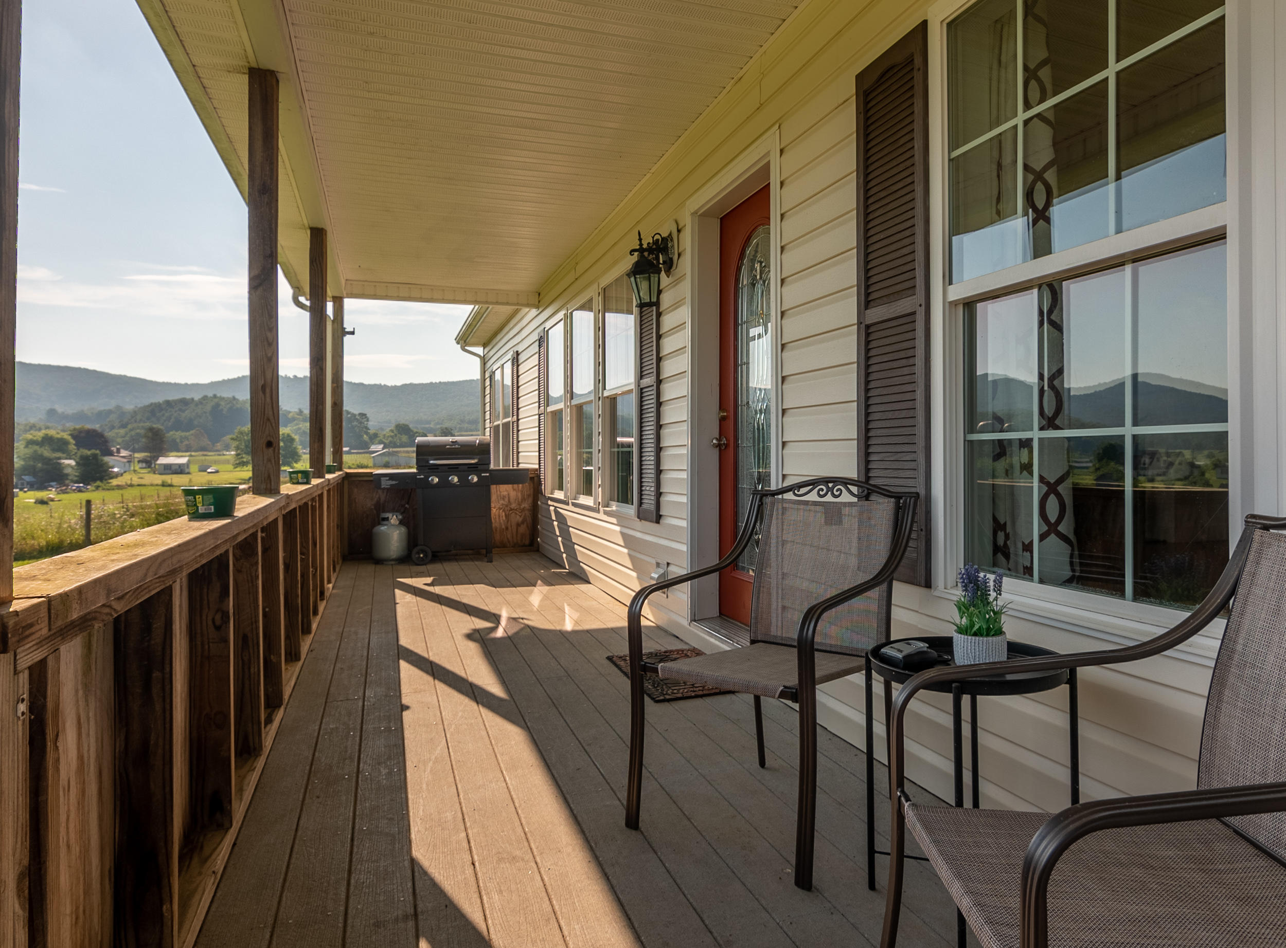 3850 Hopper Lane Riner, VA 24149 - Photo 17 of 50 a view of a balcony with chairs and a table