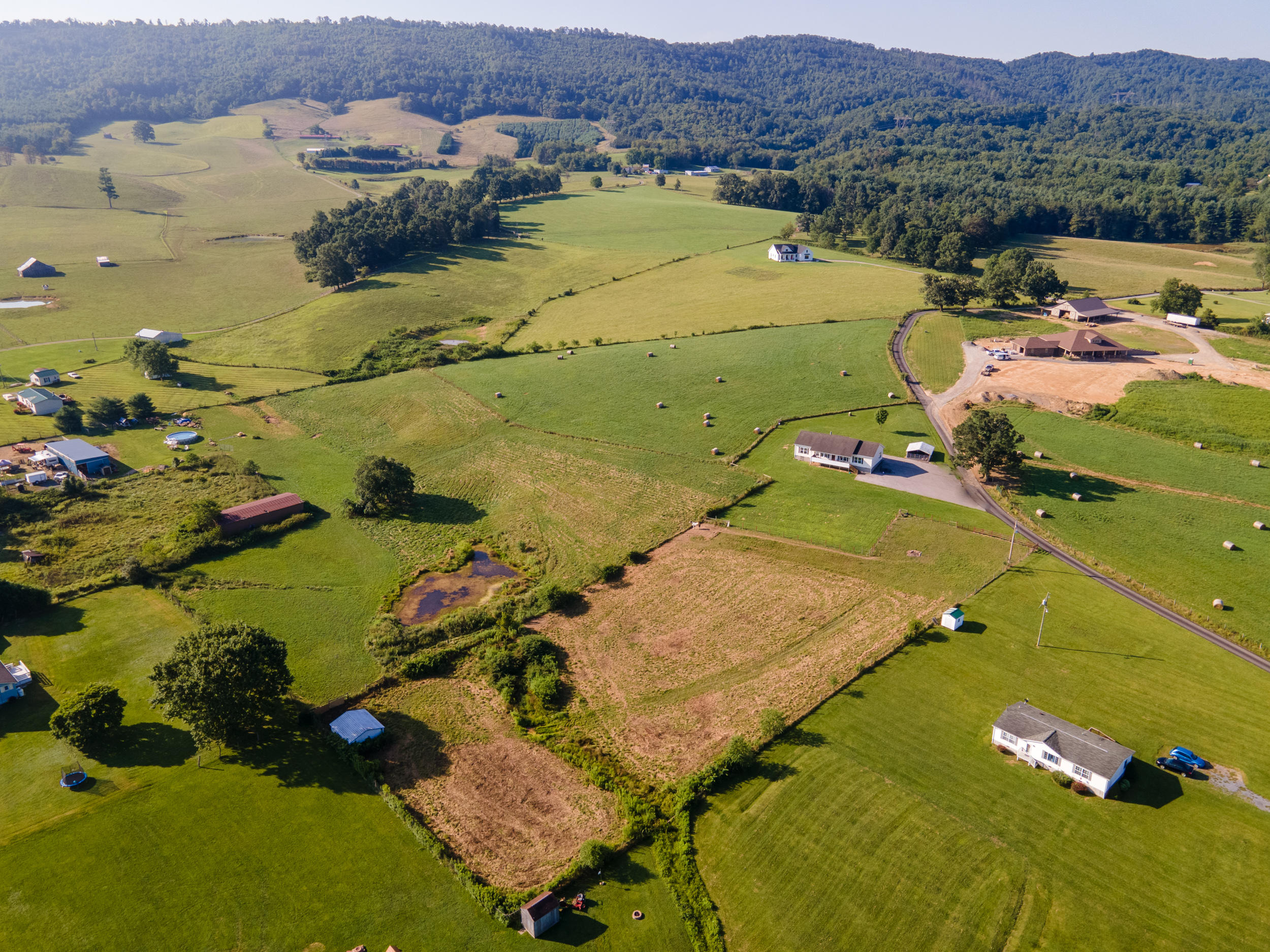 3850 Hopper Lane Riner, VA 24149 - Photo 3 of 50 an aerial view of a houses with a lake view