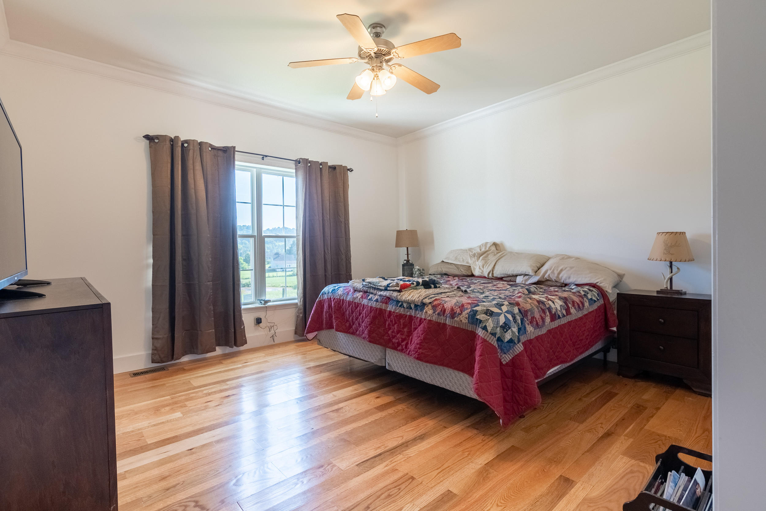3850 Hopper Lane Riner, VA 24149 - Photo 24 of 50 a bedroom with a bed and wooden floor
