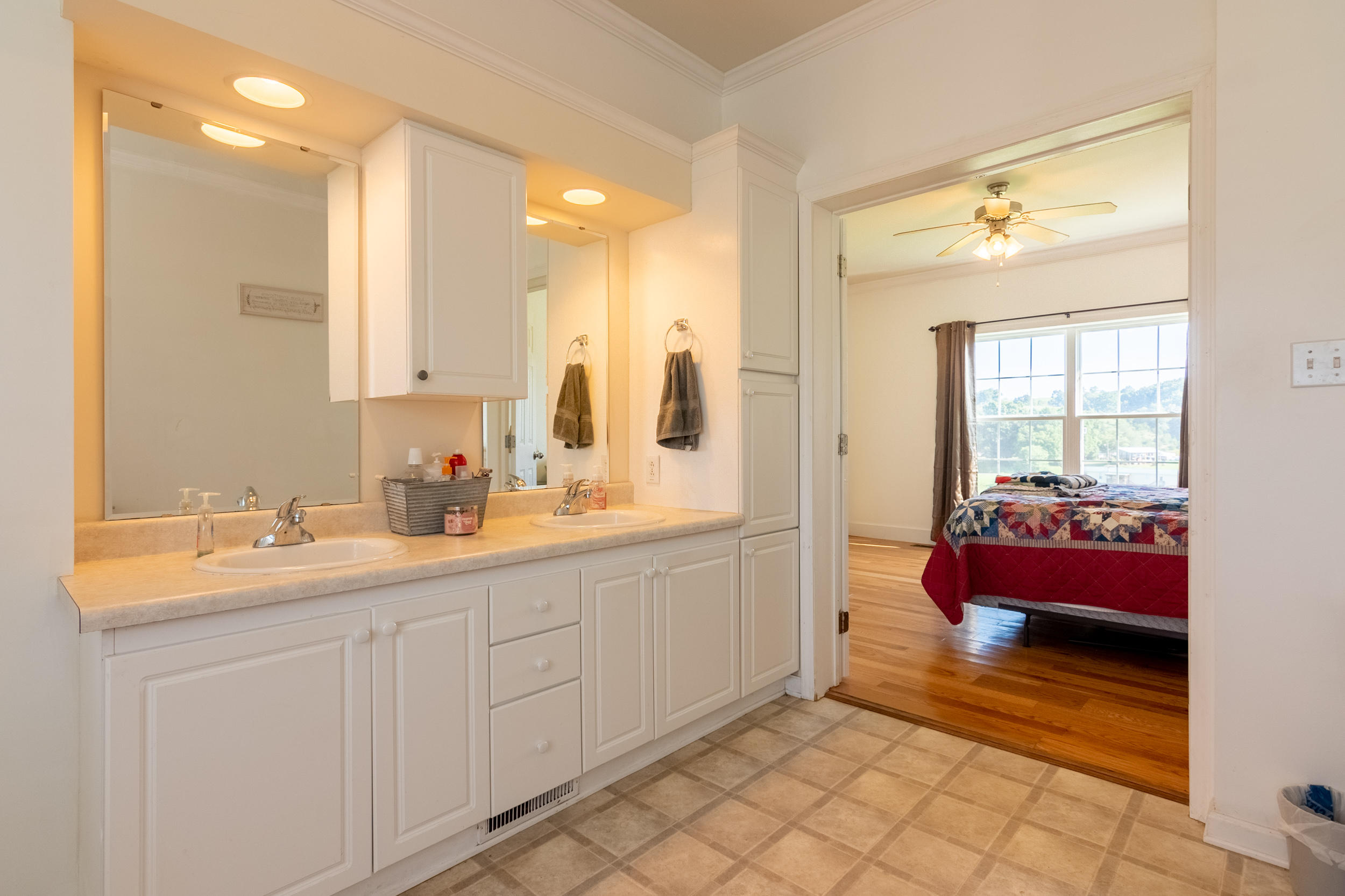 3850 Hopper Lane Riner, VA 24149 - Photo 27 of 50 a spacious bathroom with a double vanity sink mirror and