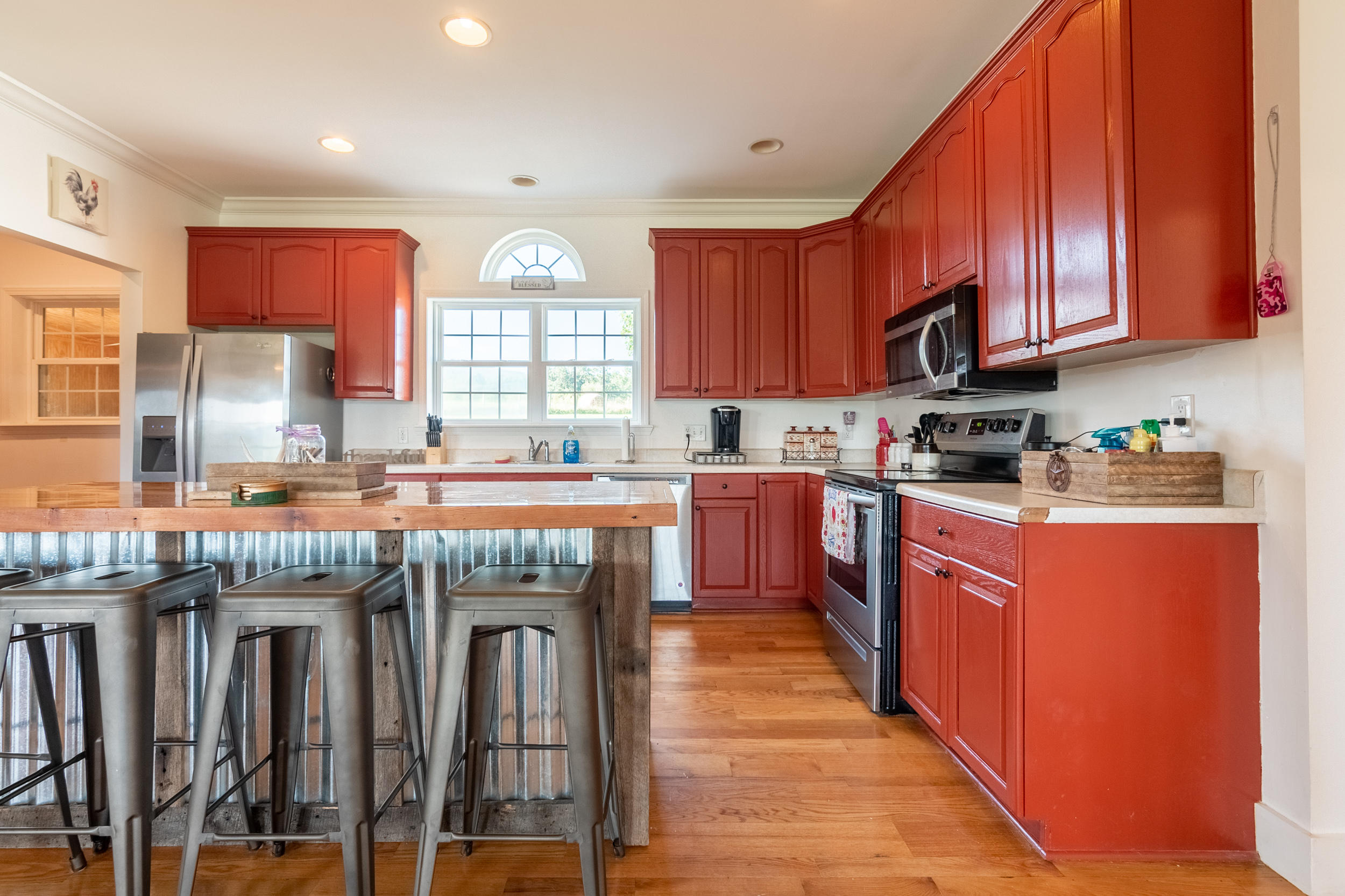 3850 Hopper Lane Riner, VA 24149 - Photo 33 of 50 a kitchen with stainless steel appliances granite countertop wooden cabinets a sink and a stove
