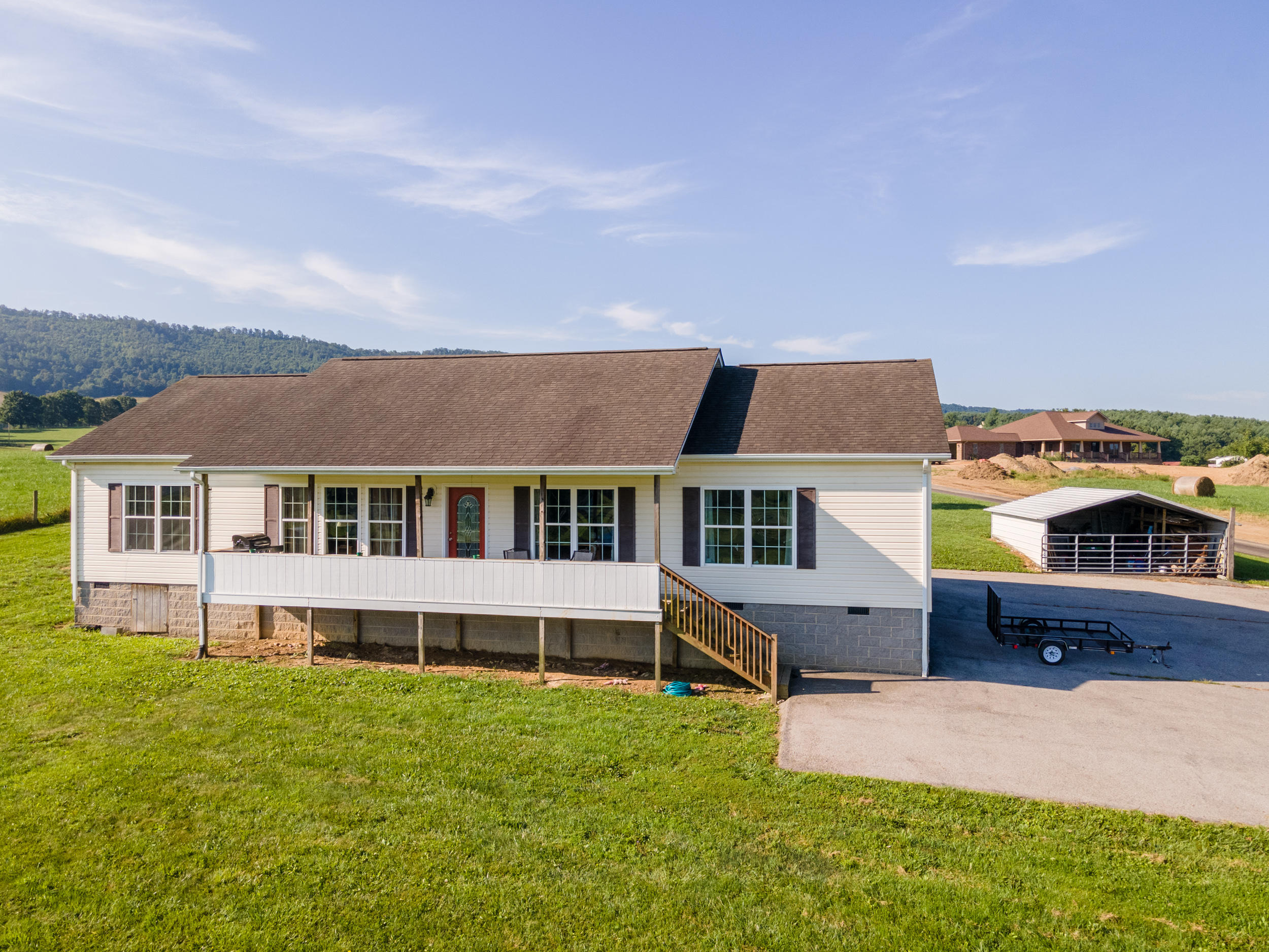 3850 Hopper Lane Riner, VA 24149 - Photo 9 of 50 a front view of a house with a garden