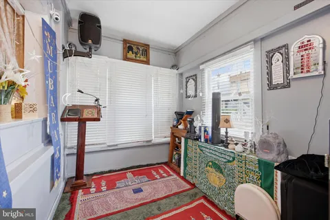 a bedroom with furniture and a window