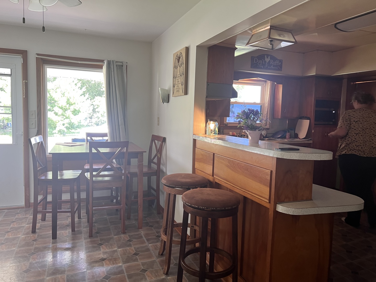 301 Dilks Street Roberts, IL 60962 - Photo 15 of 44 a view of a dining room with furniture and window
