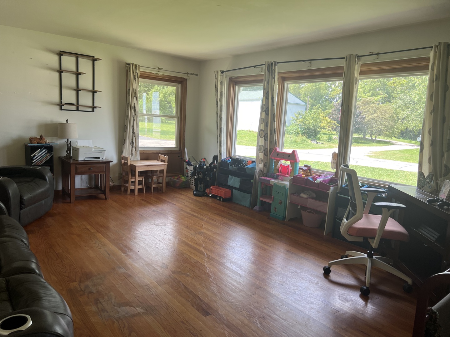 301 Dilks Street Roberts, IL 60962 - Photo 16 of 44 a living room with furniture and floor to ceiling window