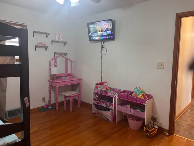 a bedroom with a bed and chandelier