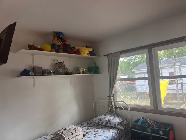 a view of a refrigerator in kitchen