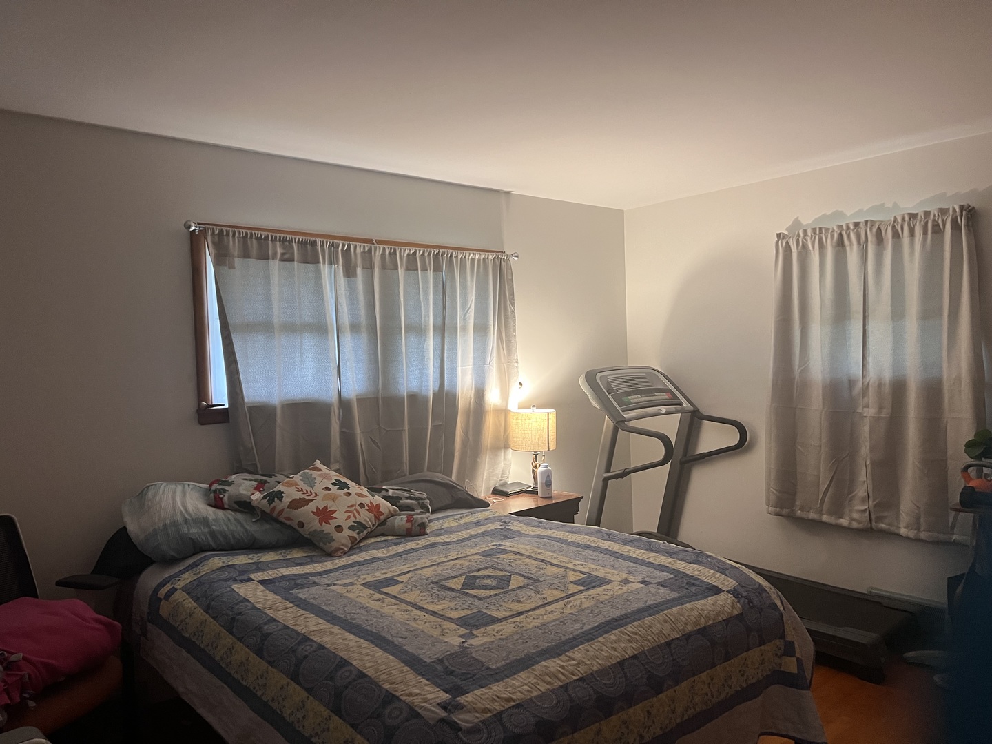 301 Dilks Street Roberts, IL 60962 - Photo 44 of 44 a bedroom with a bed a couch and a dresser with wooden floor