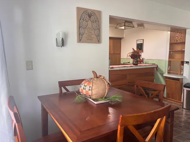 a view of a dining room with furniture