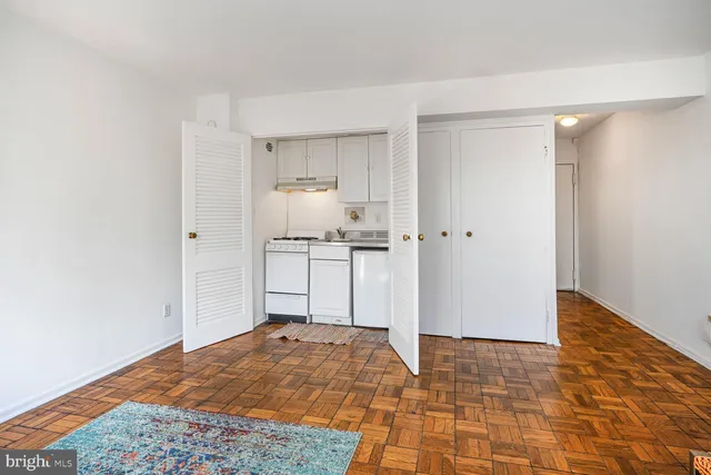a view of a kitchen with a sink and cabinets