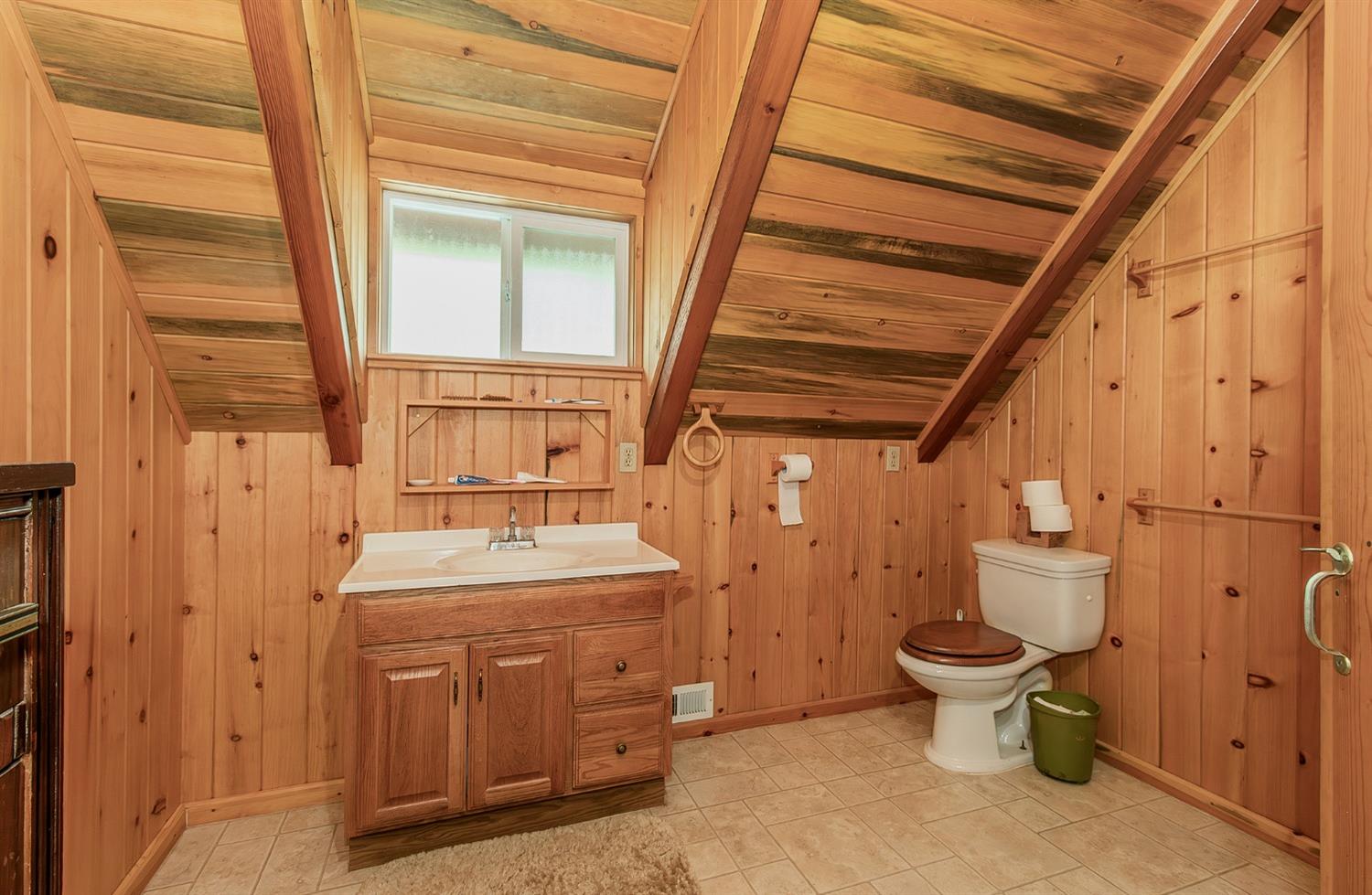 33288 Linson Road Tollhouse, CA 93667 - Photo 16 of 54 a bathroom with a sink toilet and shower