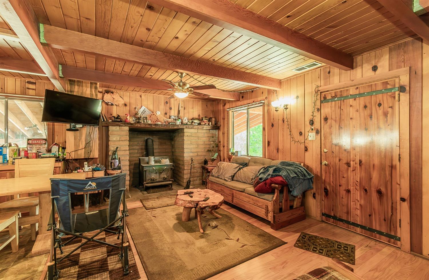 33288 Linson Road Tollhouse, CA 93667 - Photo 3 of 54 a living room with furniture and a fireplace