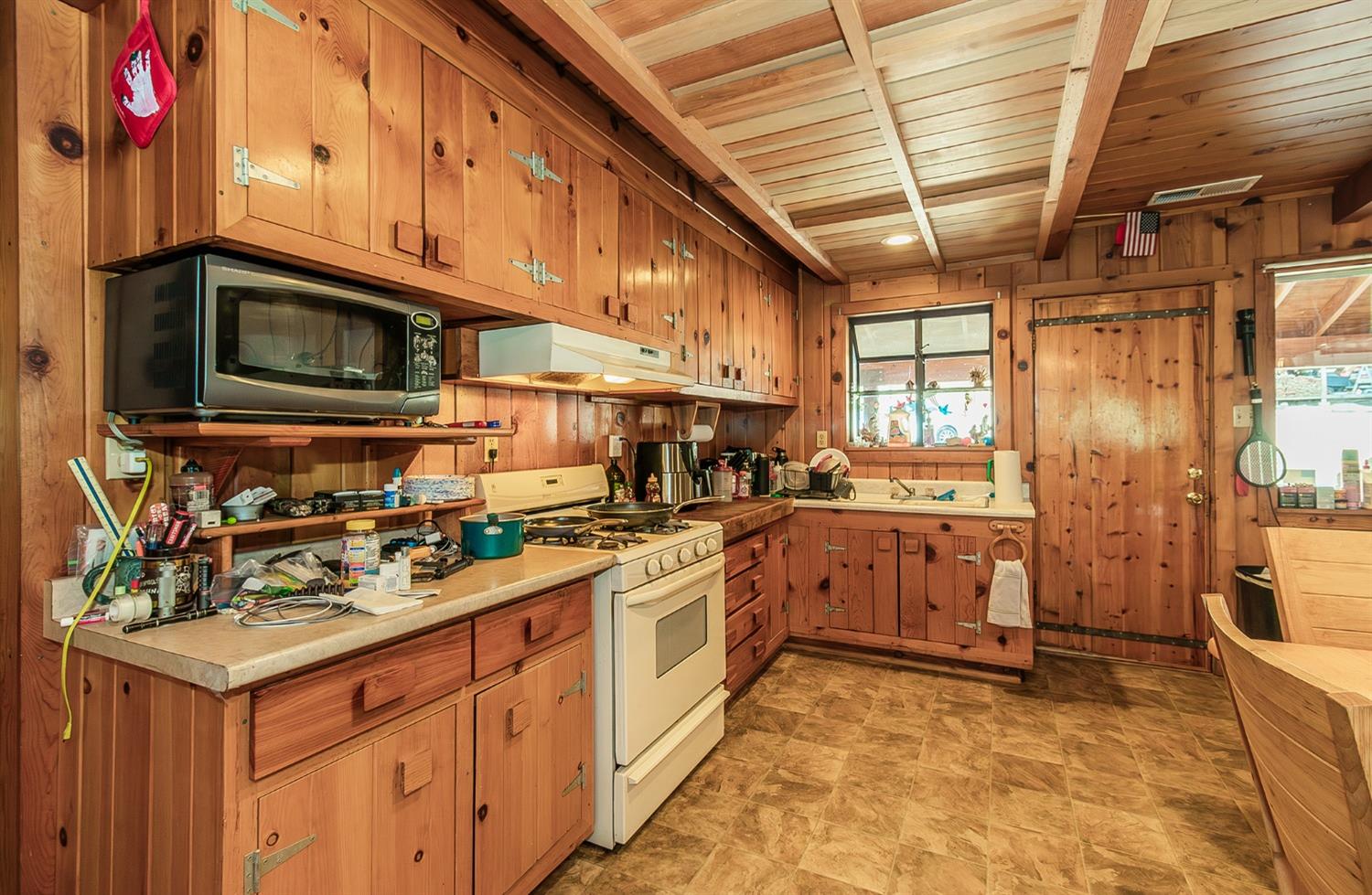 33288 Linson Road Tollhouse, CA 93667 - Photo 5 of 54 a kitchen with stainless steel appliances granite countertop a stove sink and cabinets