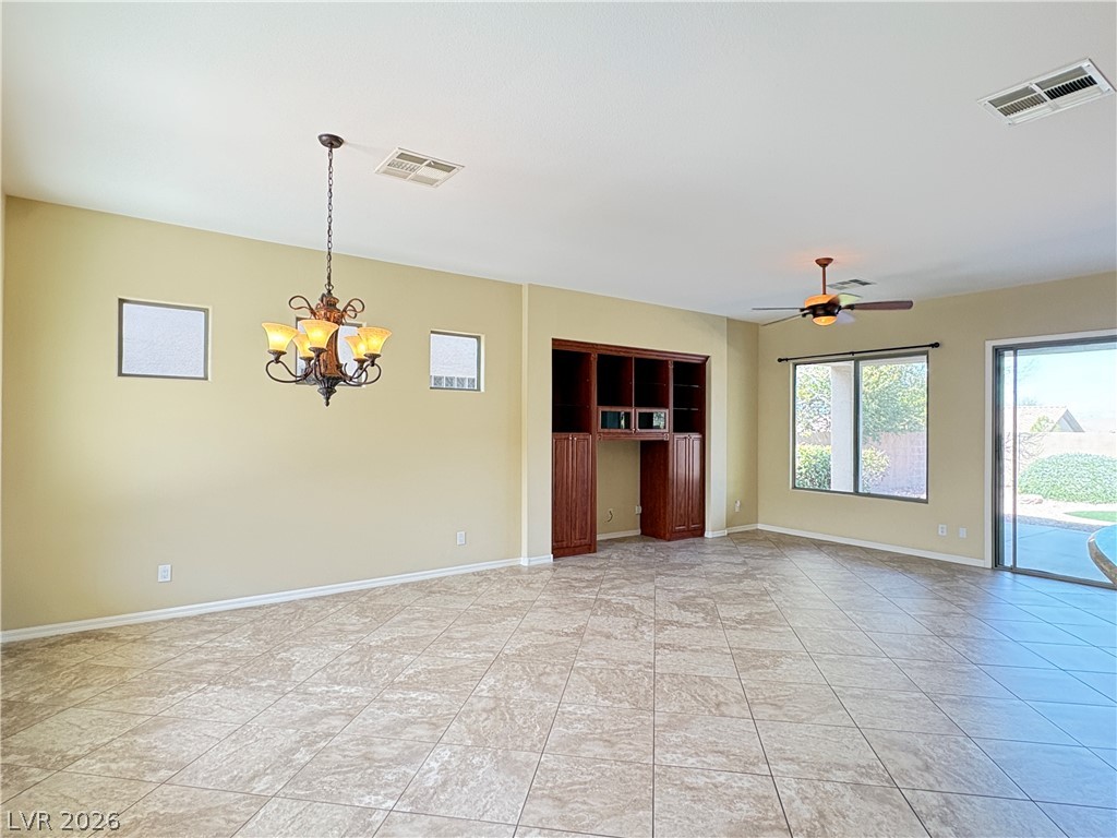 10 Caprington Road Henderson, NV 89052 - Photo 12 of 44 A spacious common area with built-in features and elegant tiled flooring.