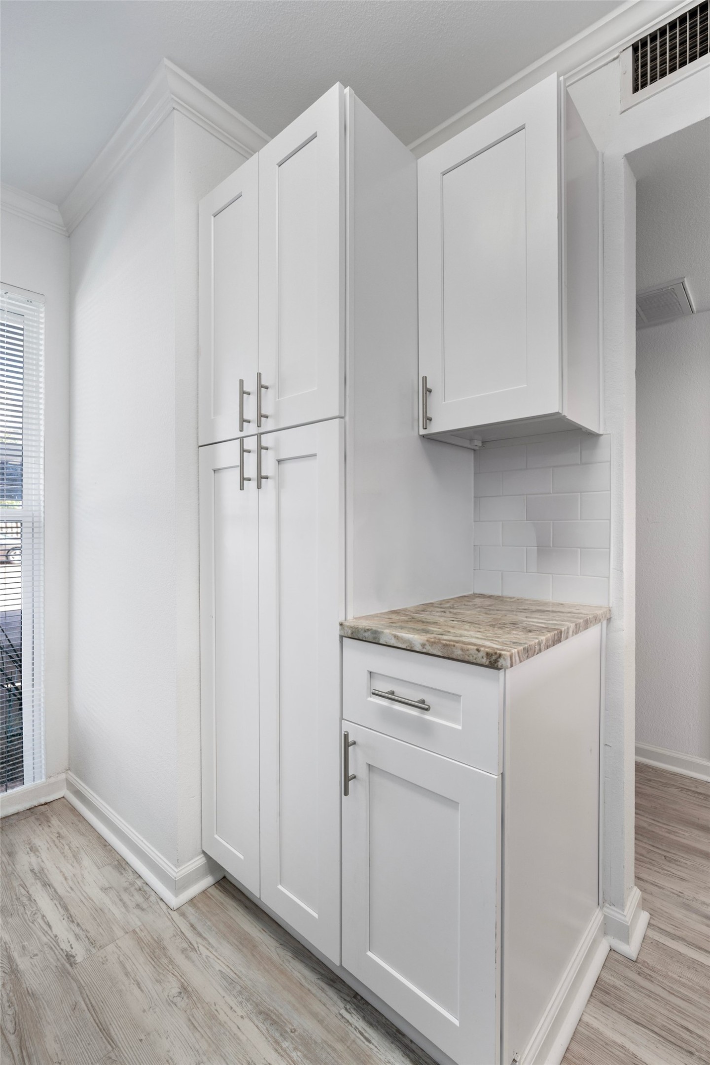 2018 West Rundberg Lane, Unit 16D Austin, TX 78758 - Photo 8 of 18 White cabinetry provides ample storage.