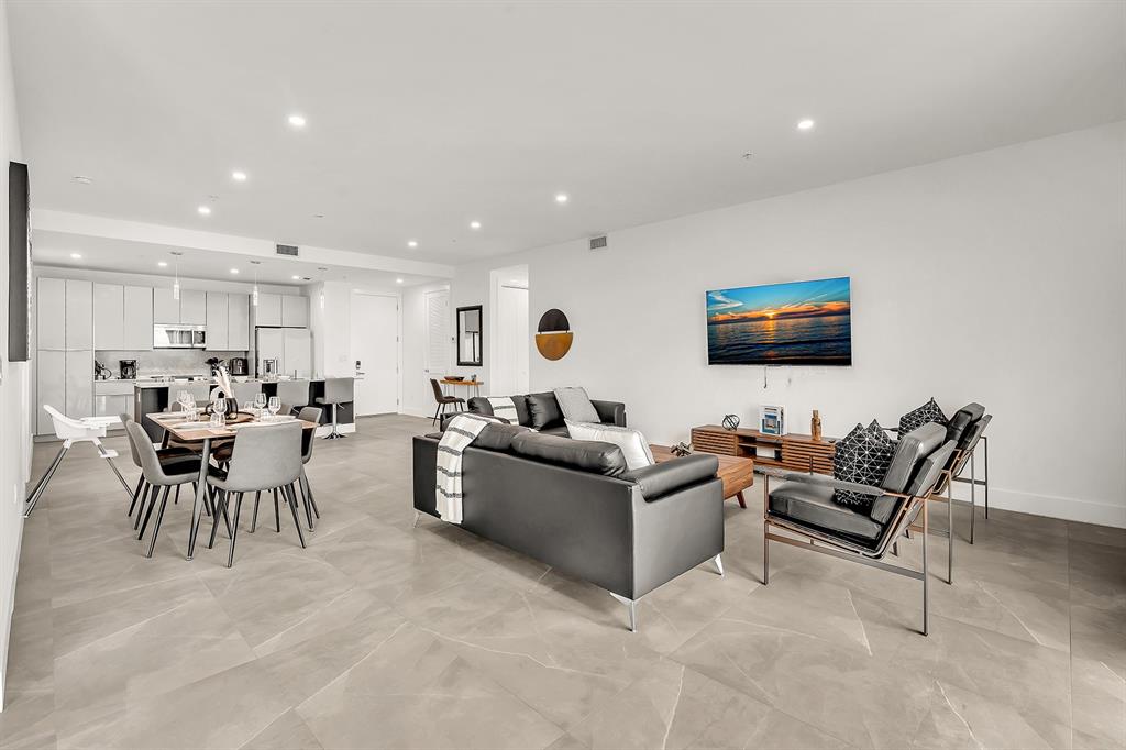 2100 Miami Road, Unit 403 Fort Lauderdale, FL 33316 - Photo 11 of 38 a living room with furniture and a flat screen tv