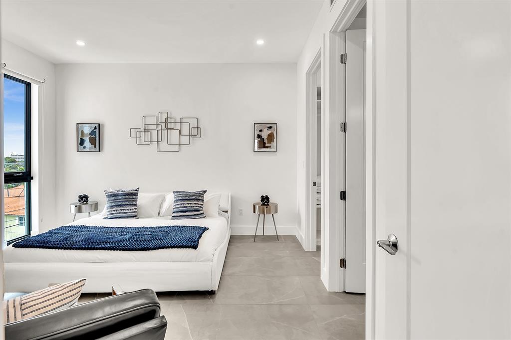 2100 Miami Road, Unit 403 Fort Lauderdale, FL 33316 - Photo 12 of 38 a living room with furniture and a window