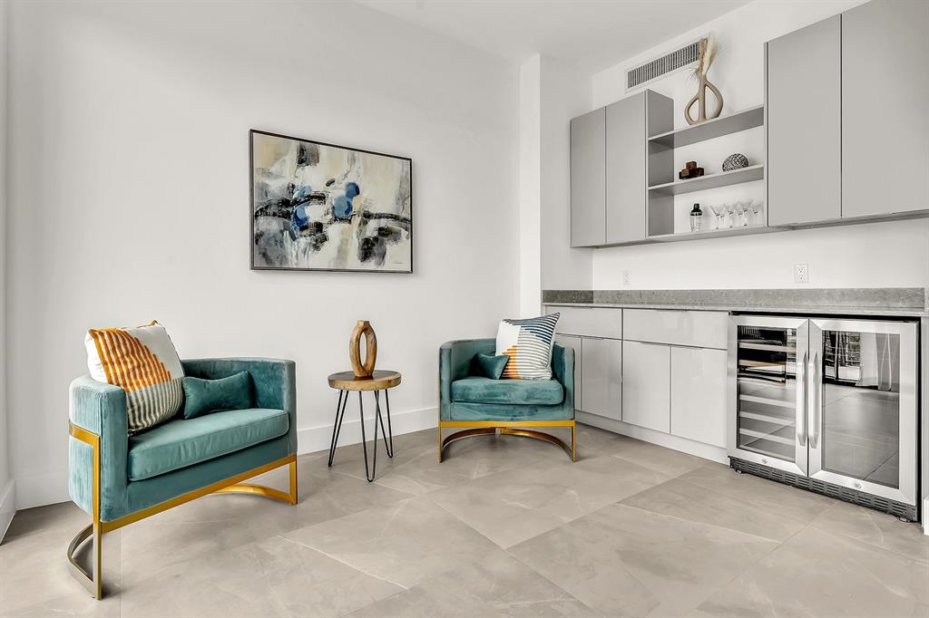 2100 Miami Road, Unit 403 Fort Lauderdale, FL 33316 - Photo 2 of 38 a living room with furniture and kitchen view