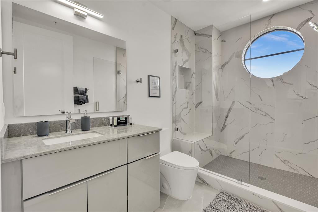 2100 Miami Road, Unit 403 Fort Lauderdale, FL 33316 - Photo 22 of 38 a bathroom with a sink toilet and shower