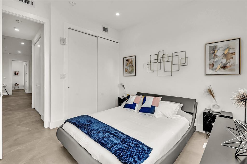 2100 Miami Road, Unit 403 Fort Lauderdale, FL 33316 - Photo 24 of 38 a bedroom with a bed and a view of bathroom