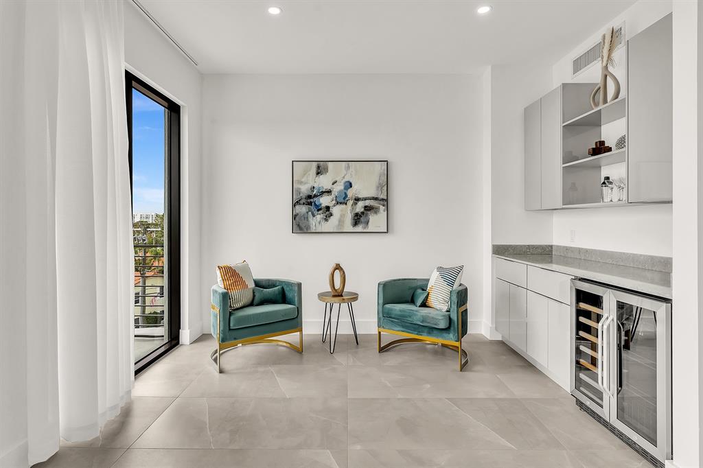 2100 Miami Road, Unit 403 Fort Lauderdale, FL 33316 - Photo 26 of 38 a living room with furniture and a fireplace