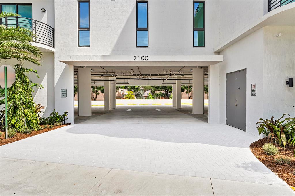 2100 Miami Road, Unit 403 Fort Lauderdale, FL 33316 - Photo 5 of 38 a view of entrance with fireplace and potted plants