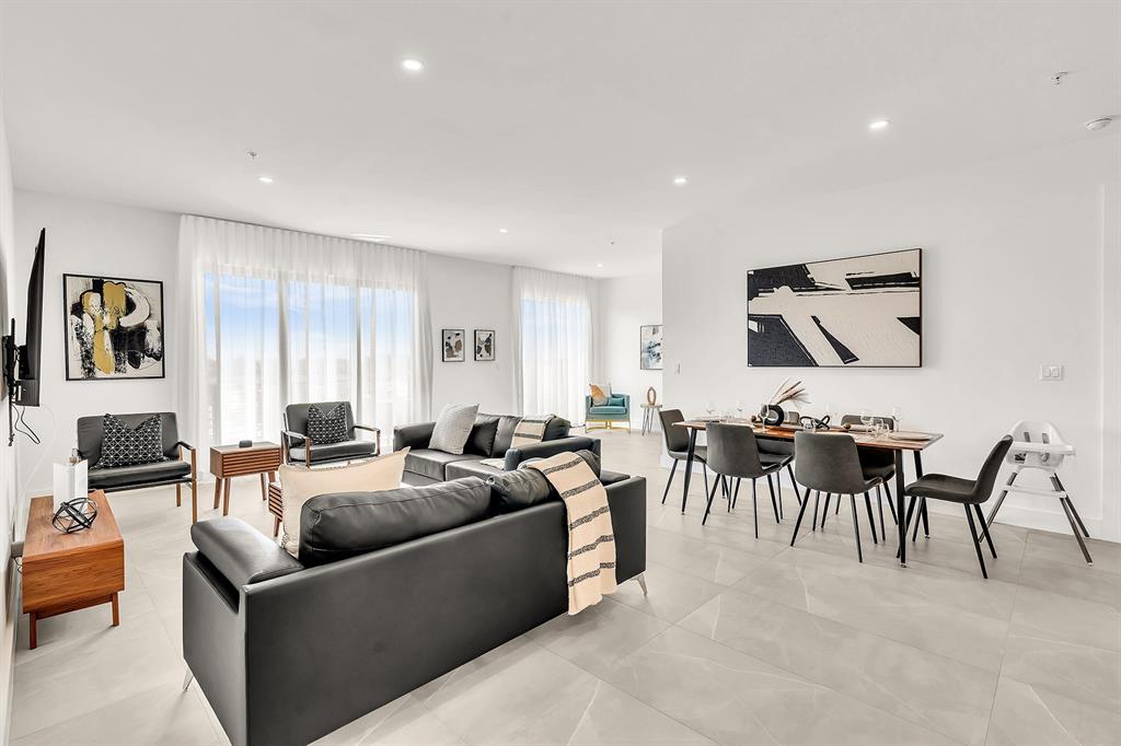 2100 Miami Road, Unit 403 Fort Lauderdale, FL 33316 - Photo 7 of 38 a living room with furniture a fireplace and a flat screen tv