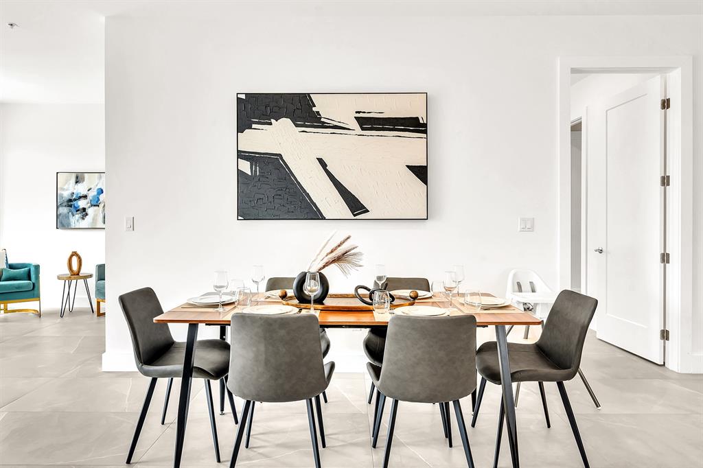 2100 Miami Road, Unit 403 Fort Lauderdale, FL 33316 - Photo 8 of 38 a view of a dining room with furniture and wooden floor