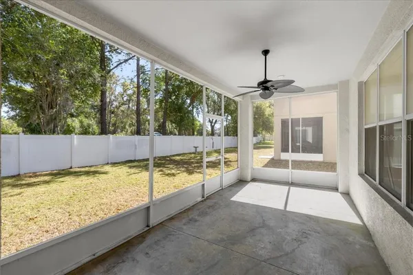 a view of a living room and floor to ceiling window