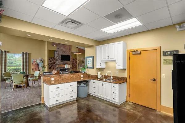 a large kitchen with cabinets and stainless steel appliances