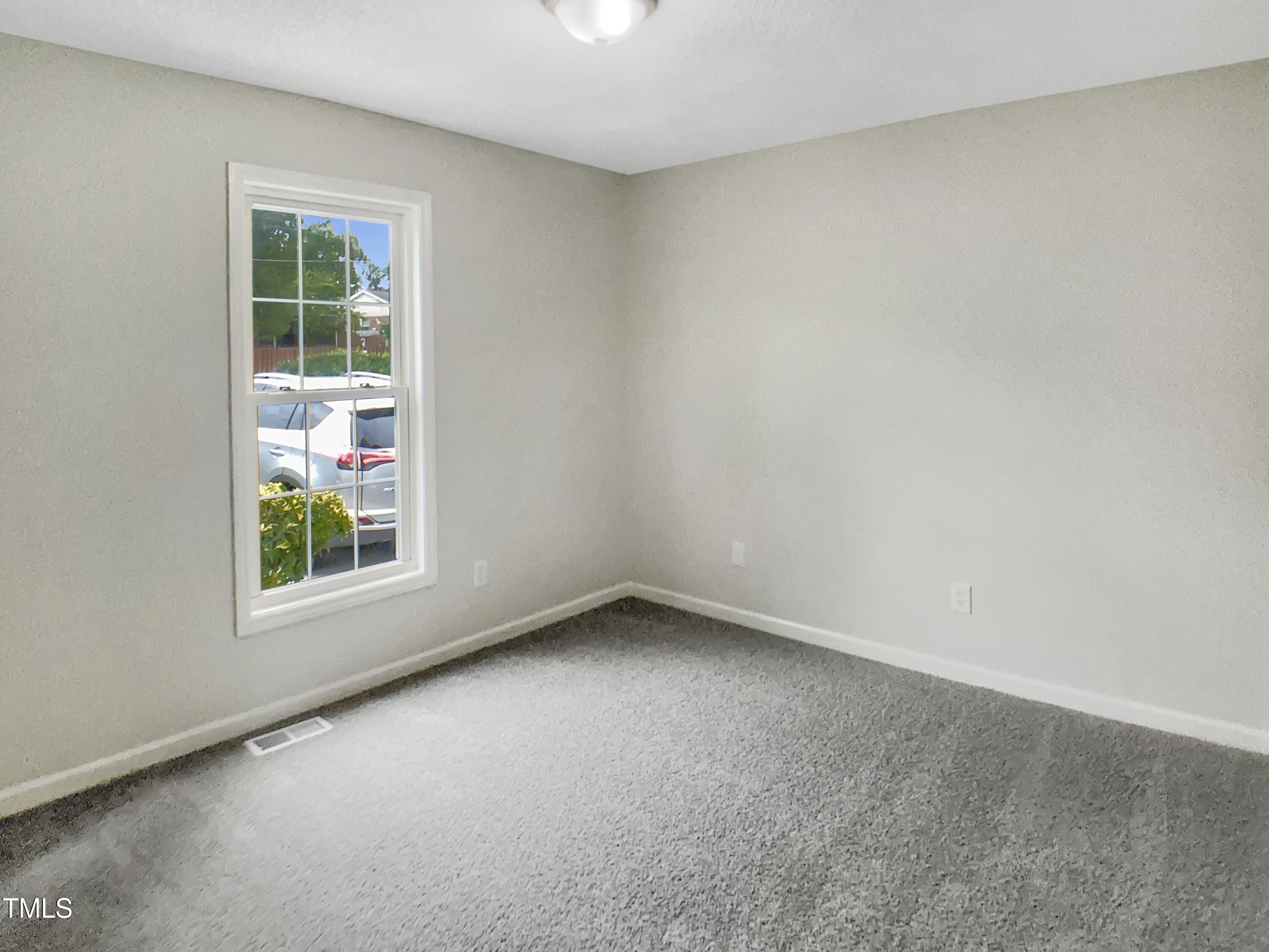 3509 Neptune Drive Raleigh, NC 27604 - Photo 13 of 18 an empty room with a window