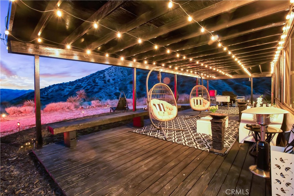 49490 Big Morongo Canyon Road Morongo Valley, CA 92256 - Photo 52 of 75 a view of a chairs room with an outdoor space