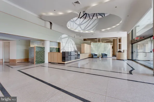 a view of a room with kitchen view and a window