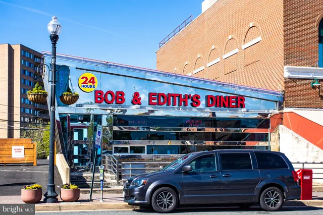 a front view of a building with parking