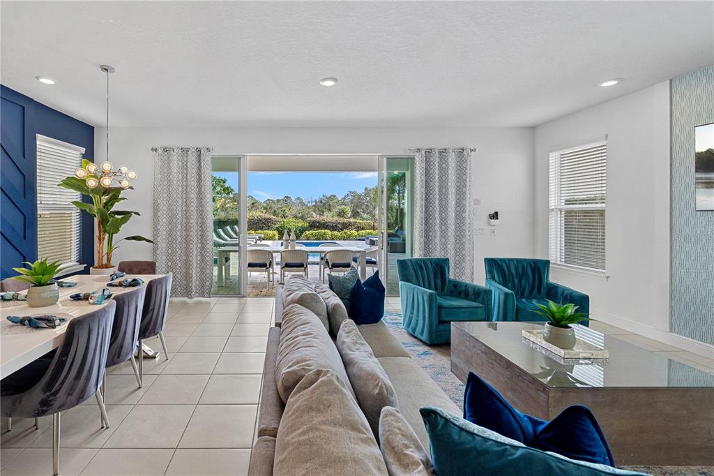 7622 Excitement Drive Reunion, FL 34747 - Photo 11 of 46 a living room with furniture and a large window