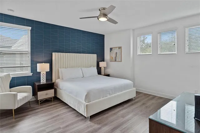 a bathroom with a granite countertop sink mirror and a shower