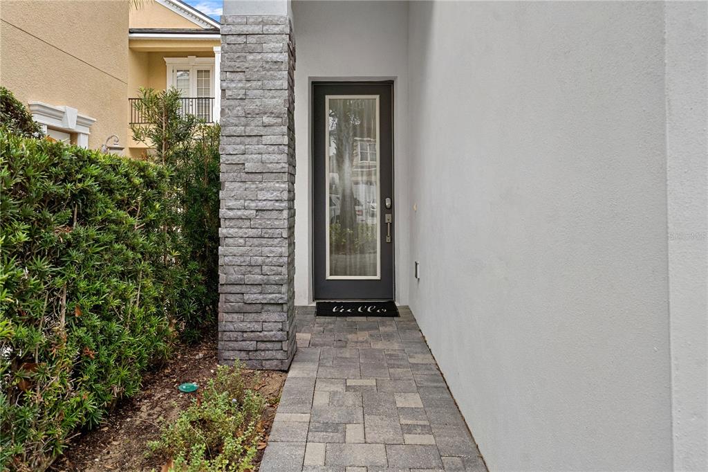 7622 Excitement Drive Reunion, FL 34747 - Photo 2 of 46 a view of a pathway besides a house