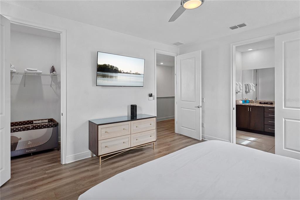 7622 Excitement Drive Reunion, FL 34747 - Photo 21 of 46 a bedroom with furniture and mirror