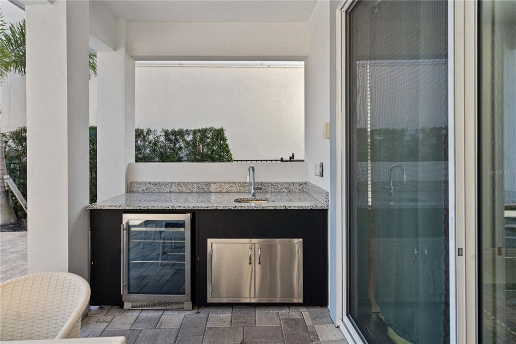 7622 Excitement Drive Reunion, FL 34747 - Photo 34 of 46 a room with a granite countertop sink a toilet and shower