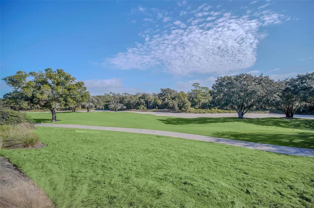 7622 Excitement Drive Reunion, FL 34747 - Photo 36 of 46 a view of a field of grass and trees