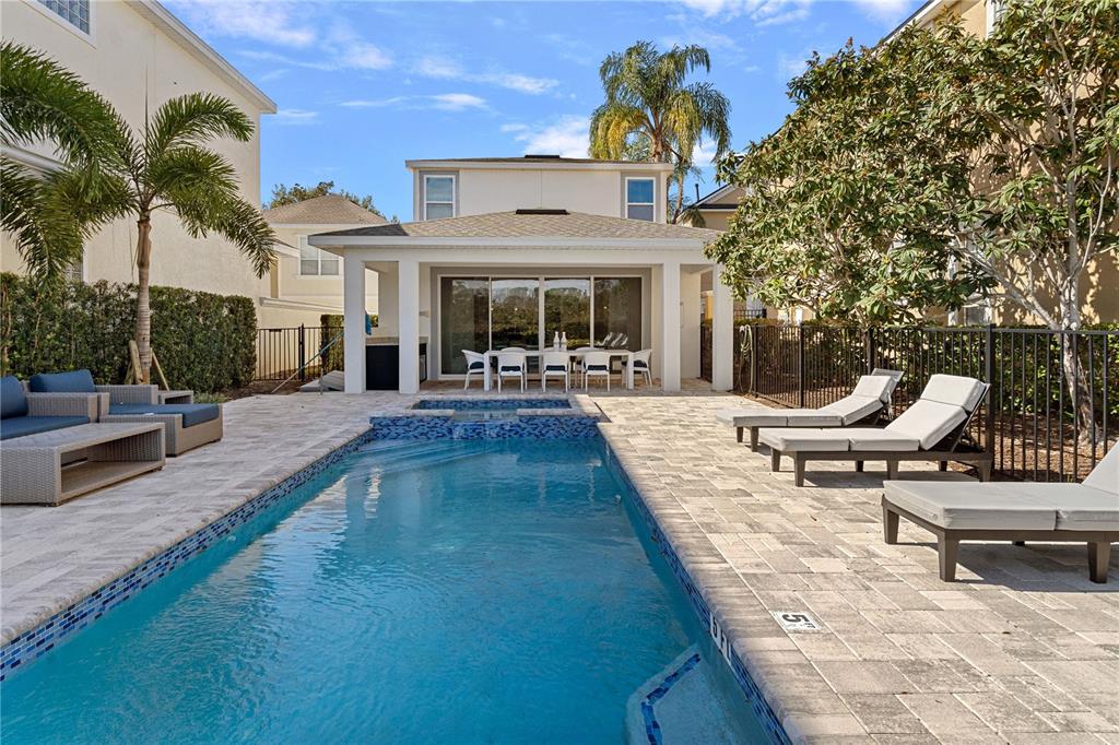 7622 Excitement Drive Reunion, FL 34747 - Photo 38 of 46 a view of a patio with swimming pool table and chairs