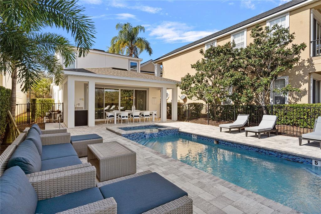 7622 Excitement Drive Reunion, FL 34747 - Photo 41 of 46 a view of a patio with couches and a swimming pool with a patio