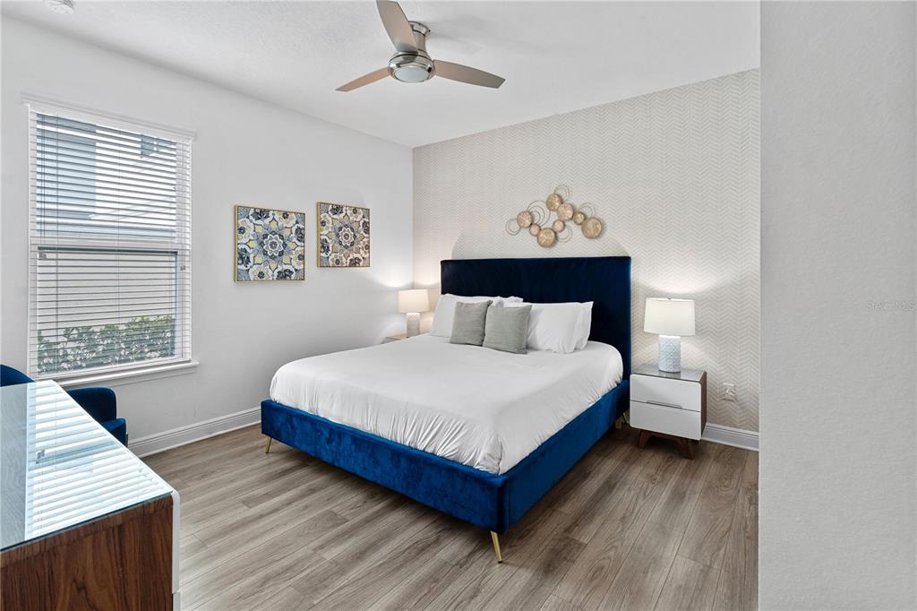 7622 Excitement Drive Reunion, FL 34747 - Photo 5 of 46 a bedroom with a bed and a window