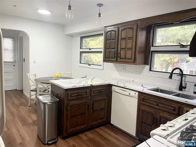 a view of a room with wooden floor
