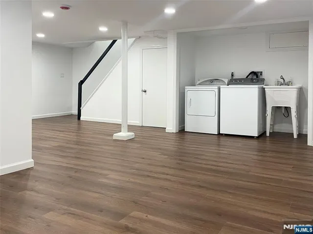 a bathroom with a sink toilet and window